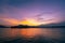 Dramatic panorama evening sky and clouds over mountain and lake at sunset