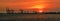 Dramatic panorama evening sky over beautiful port at sunset