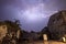 Dramatic photo of a lightning storm over graffiti and warehouses