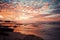 Dramatic Pink and Orange Sunset Over the Reflective Beach