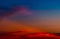 Dramatic red and blue sky and clouds abstract background. Red-blue clouds on sunset sky. Warm weather background. Art picture