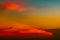 Dramatic red and orange sky and clouds abstract background. Red-orange clouds on sunset sky. Warm weather background. Art picture