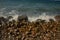 Dramatic rocks on a coastline with aegent sea.