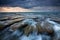 Dramatic rocks and waves on a gloomy weather