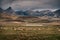 Dramatic rural mountain landscape with sheep in the foreground, Tibet