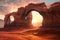 dramatic sandstone arch with glowing sunset