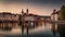 Dramatic scene with river and Jesuit church, Scenic evening panorama view of the Old Town. Wonderful vivid cityscape during sunset