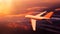 Dramatic scenery with airplane or airliner or aircraft in flight over clouds at sunset. Travel, transport industry or