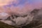 Dramatic scenery in the Dolomite Alps, Italy, in summer, with storm clouds and majestic peaks