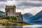 Dramatic Scottish castle with a moody sky on the shore of a sea loch Eilean Donan, Highlands