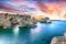 Dramatic seascape with cliffs, rocky arch at Torre Sant Andrea