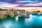 Dramatic seascape with cliffs, rocky arch at Torre Sant Andrea