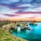 Dramatic seascape with cliffs, rocky arch at Torre Sant Andrea