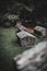 Dramatic shot of weathered and old gravestones near the forest