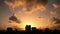 Dramatic silhouette city skyline timelapse at sunset with clouds moving over city