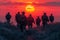 Dramatic silhouettes of soldiers on a mission against the backdrop of a setting sun