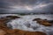 Dramatic sky, big waves, cloudscape just before the storm near the shore