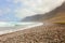 Dramatic sky with clouds on beautiful ocean beach with waves Caleta Famara, Lanzarote, Spain