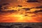 Dramatic sky with cloudscape over the sea waves, sunrise shot