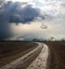 Dramatic sky over dirty road