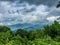 Dramatic sky over distant blue mountains