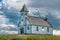 Dramatic sky over the historic Peace Lutheran Church in Stonehenge, SK