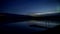 Dramatic sky over lake at night, 4K time lapse