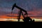 Dramatic Sky Over Pumpjack Silhouette in Rural Alberta, Canada