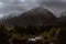 Dramatic sky with sunbeams breaking through heavy clouds over the Slavkovsky siit peak 2452m is the fourth highest mountain peak