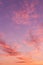 Dramatic soft sunrise, sunset pink violet orange sky with clouds background texture