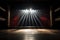 dramatic spotlight shining on an empty theater stage