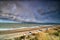 Dramatic storm cloud rolling over sea coast