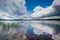 Dramatic storm clouds reflecting in Massabesic Lake, in Auburn,