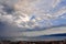 Dramatic stormy sky with rainy clouds, horizon and adriatic sea