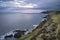 Dramatic stormy sunrise landscape over Bull Point in Devon England