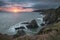 Dramatic stormy sunrise landscape over Bull Point in Devon England