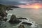 Dramatic stormy sunrise landscape over Bull Point in Devon England