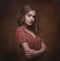 Dramatic studio portrait of a young beautiful brunette woman wit