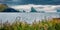 Dramatic summer panorama of Faroe Islands and Tindholmur cliffs on background