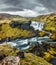 Dramatic summer scene of waterfall on Skoga river. Gloomy morning view from the tourist trek from famous Skogafoss waterfall to th