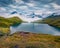 Dramatic summer view of Bachsee lake with Wetterhorn and Wellhorn peaks on background.