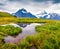 Dramatic summer view with a Mt. Schreckhorn and Wetterhorn on the background.