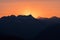 Dramatic sun rays behind Heaven`s Peak, Glacier National Park, Montana