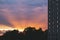 Dramatic sunbeams behind the Residential Building With Reflections in a Windows, Background Photo