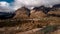 Dramatic sunlight and shadow over village under mountain time lapse