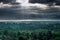 Dramatic sunrise in the mountains with thick evergreen forest in foreground, Altai Mountains, Kazakhstan