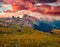 Dramatic sunrise in National Park Tre Cime di Lavaredo with Cadini di Misurina range and Sorapis group on background