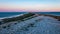 dramatic sunrise over the baltic sea with rocky beach and trees