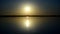 Dramatic sunrise over calm smooth water surface of river