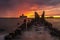 Dramatic sunrise over the sea. Famous place on the Baltic coast, beach near the old torpedo plant
